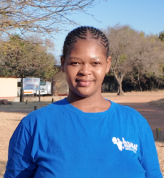 Precious Nthoke of Blessman International standing on the Blessman International campus.